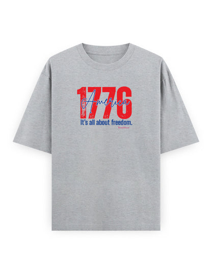 Grey oversized t-shirt with red '1776 America' and blue 'It's all about freedom' graphic print