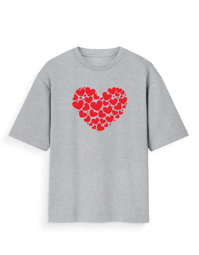 Grey oversized t-shirt with red heart cluster graphic, streetwear casual style.