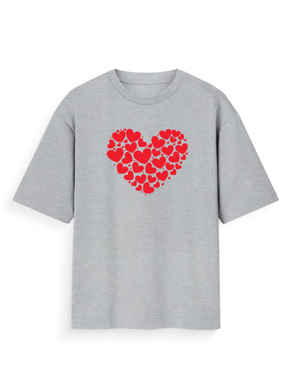 Grey oversized t-shirt with red heart cluster graphic, streetwear casual style.