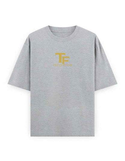 Grey oversized streetwear t-shirt with yellow TF logo and text on chest