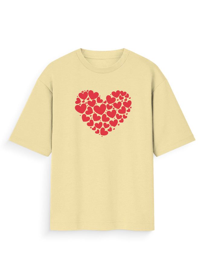 Beige oversized t-shirt with red heart graphic made of smaller hearts, streetwear style