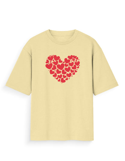 Beige oversized t-shirt with red heart graphic made of smaller hearts, streetwear style