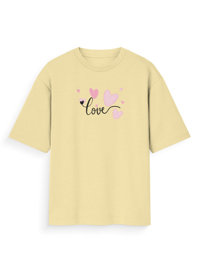 Oversized beige t-shirt with 'love' text and pink heart graphics, streetwear style