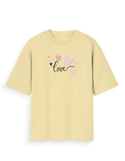 Oversized beige t-shirt with 'love' text and pink heart graphics, streetwear style