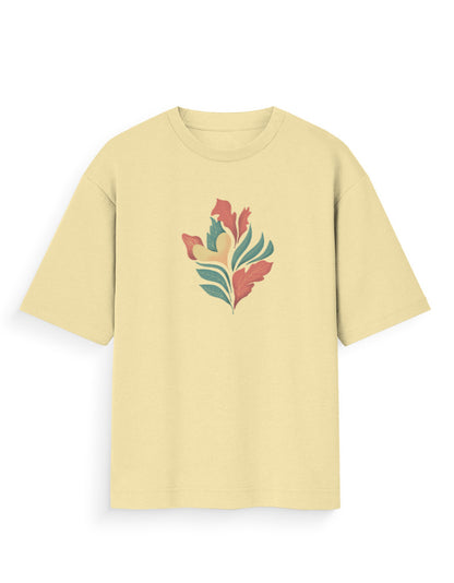 Oversized beige t-shirt with colorful abstract leaf graphic, modern streetwear style