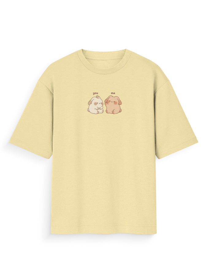 Oversized beige t-shirt with cute dog graphic and 'you me' text, streetwear fashion