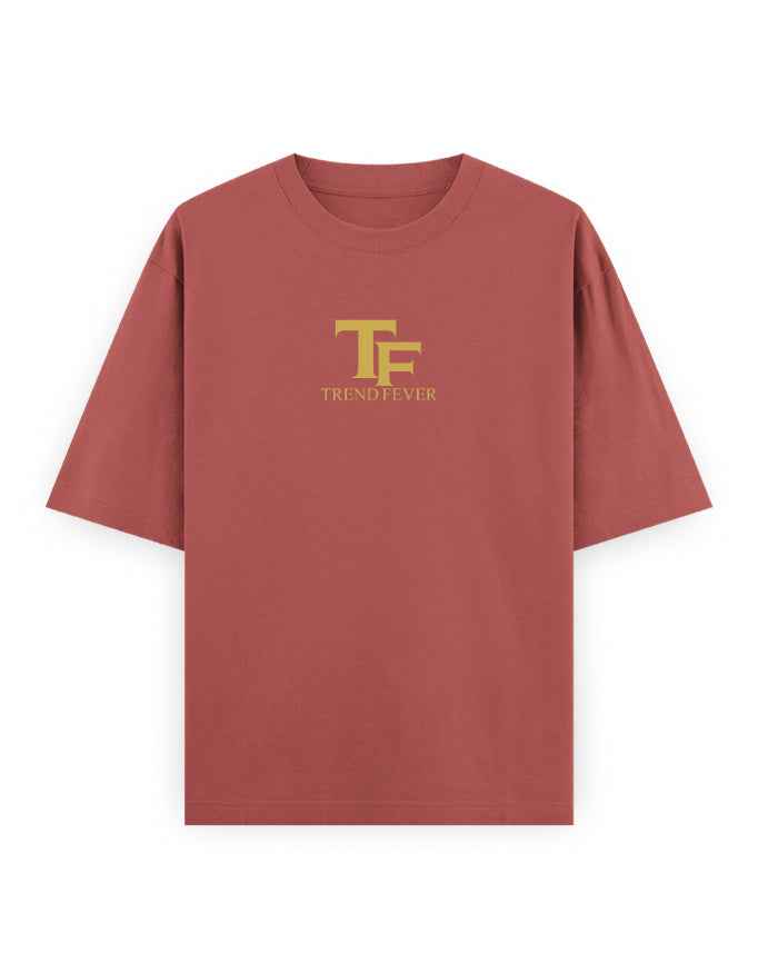 Oversized rust red t-shirt with yellow TF logo and Trend Fever text on chest