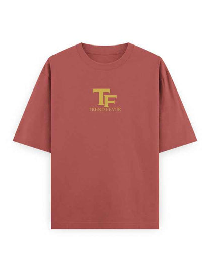 Oversized rust red t-shirt with yellow TF logo and Trend Fever text on chest