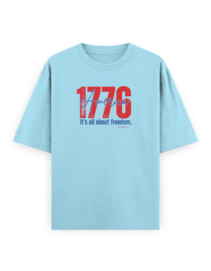 Light blue oversized t-shirt with red '1776 America' and 'It's all about freedom' print.