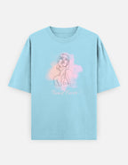 A light blue short-sleeve t-shirt with a graphic of a woman's line art over a pink and purple watercolor background, with the text 'Trend Fever' printed below.