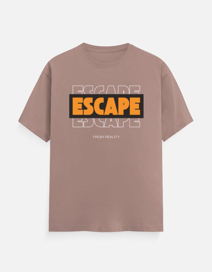 A dusty rose short-sleeve t-shirt with a graphic on the chest featuring the word 'ESCAPE' in orange and black, layered over a faint white outline of the same word, with 'FROM REALITY' printed below in small white text.