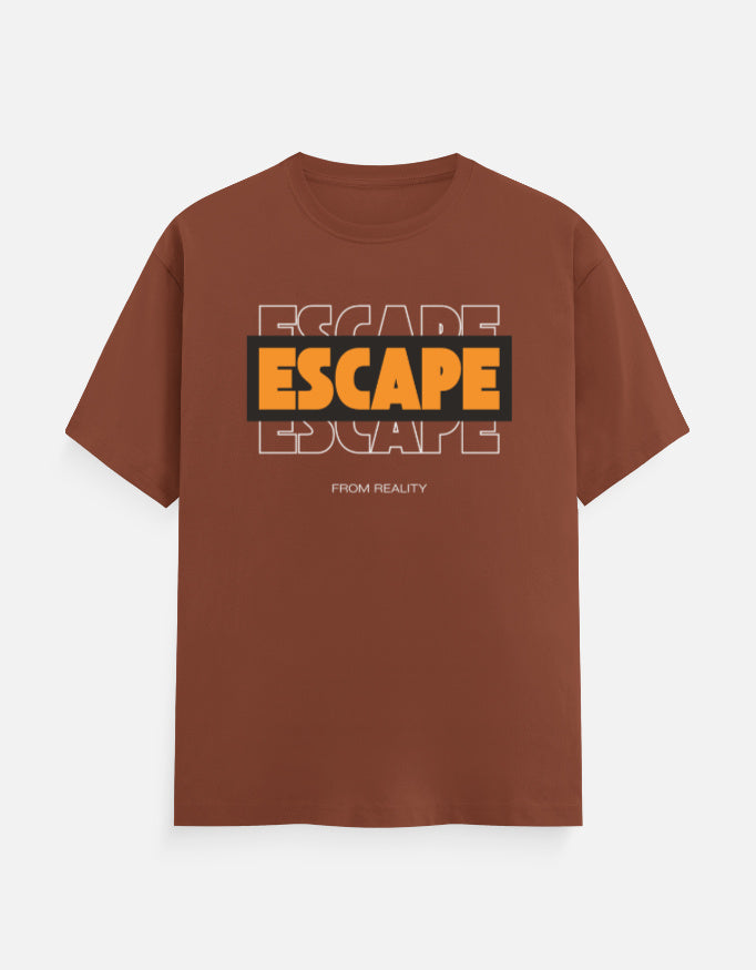 A brown short-sleeve t-shirt with a graphic on the chest reading 'ESCAPE' in orange and black, with 'FROM REALITY' printed below, displayed on a light gray background.