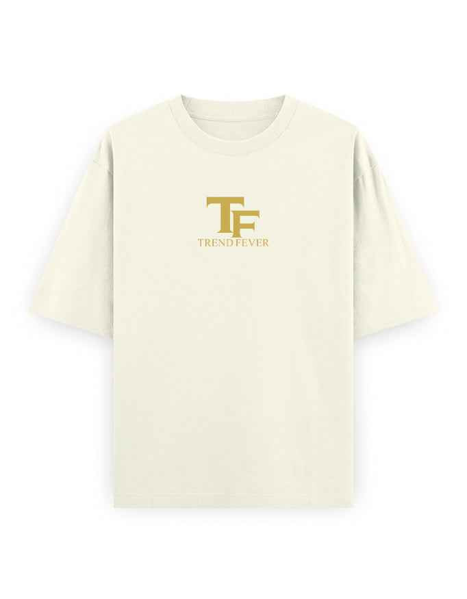 Oversized beige streetwear t-shirt with gold TF logo and TREND FEVER text on front