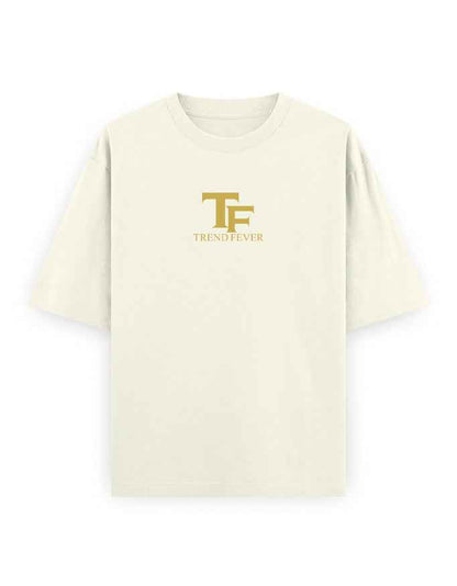 Oversized beige streetwear t-shirt with gold TF logo and TREND FEVER text on front