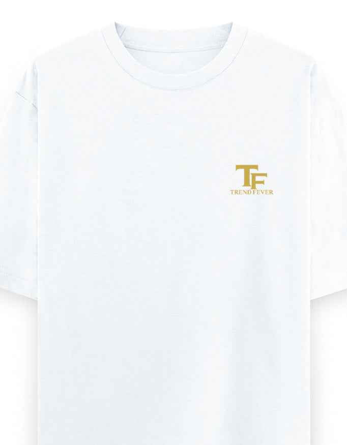 White oversized t-shirt with gold TF logo and Trend Fever text on left chest