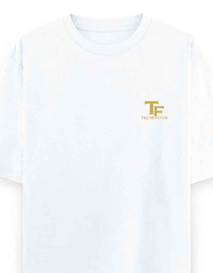 White oversized t-shirt with gold TF logo and Trend Fever text on left chest