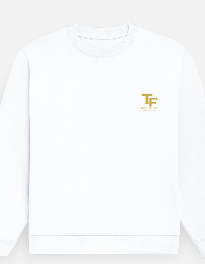 A white crewneck sweatshirt with a small gold 'TF' logo printed on the left chest, shown against a light gray background.