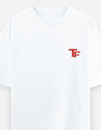 A white short-sleeve crewneck t-shirt featuring a small red stylized 'TF' logo on the left chest, displayed against a clean white background.
