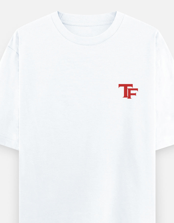 A white short-sleeve crewneck t-shirt featuring a small red stylized 'TF' logo on the left chest, displayed against a clean white background.