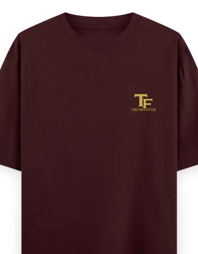 Maroon oversized t-shirt with gold TF Trend Fever logo on left chest