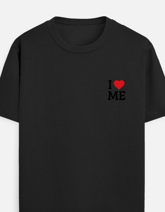A BLACK short-sleeve crewneck t-shirt featuring a small graphic on the left chest that reads 'I' followed by a red heart and ' I LOVE ME' in black block letters by TREND FEVER