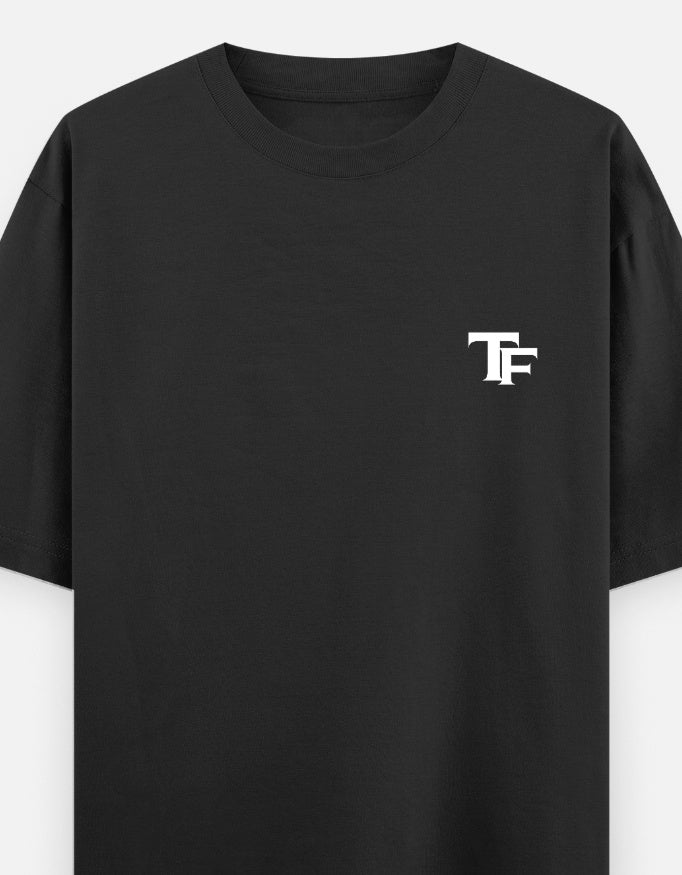 Premium black oversized T-shirt for men by Trend Fever, featuring a relaxed streetwear fit and minimalist design.
