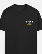 A BLACK short-sleeve crewneck t-shirt featuring a small graphic on the left chest with a barbell, a clenched fist, and the text 'NEVER GIVE UP' in yellow and black by TREND FEVER