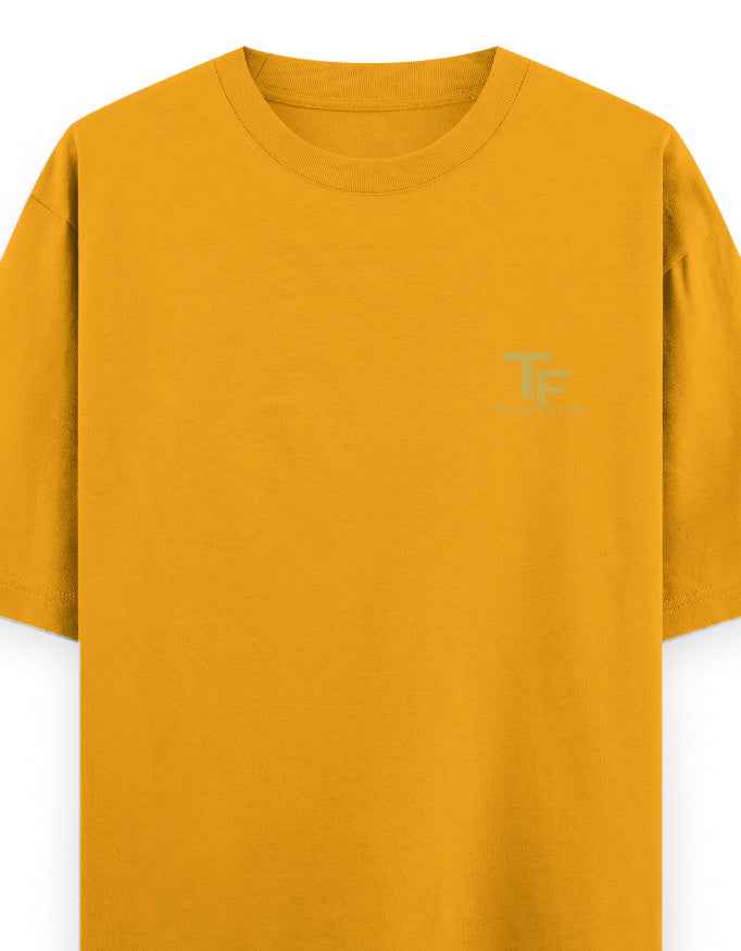Mustard yellow oversized streetwear t-shirt with subtle chest logo print