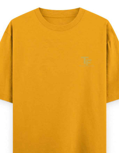 Mustard yellow oversized streetwear t-shirt with subtle chest logo print
