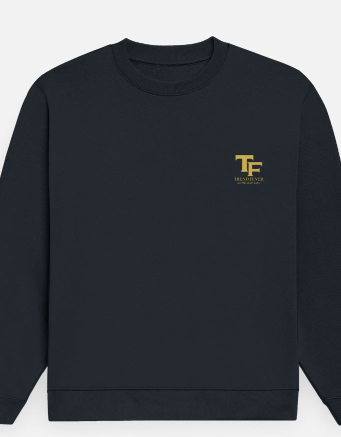 A Navy Blue crewneck sweatshirt with a small gold 'TF' logo and 'Trend Fever' printed on the left chest, displayed against a light gray background.