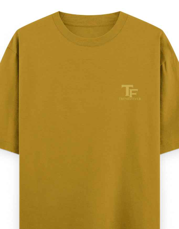 Mustard yellow oversized t-shirt with minimal chest logo, streetwear style