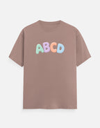 Lightweight Trend Fever ABC graphic tee for kids with playful colorful lettering on a pastel blue t-shirt.
