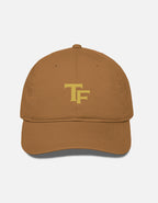 Brown cap with a Trend Fever logo on a white background