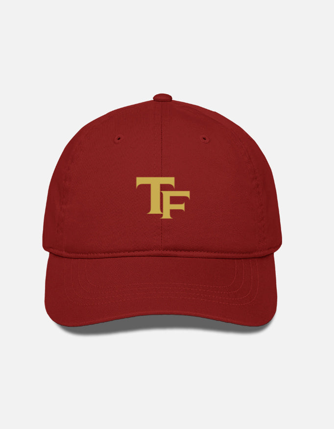 Red cap with a colorful Trend Fever logo on a light gray background