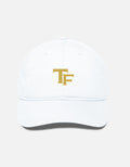 A white baseball cap with a gold embroidered 'TF - Trend Fever' logo on the front, shown against a light gray background.