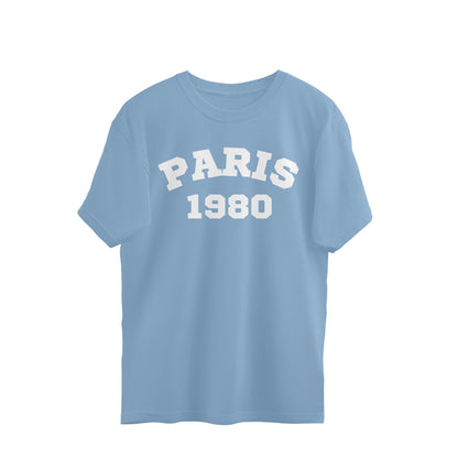 Baby blue oversized t-shirt with white 'PARIS 1980' text on front, streetwear style