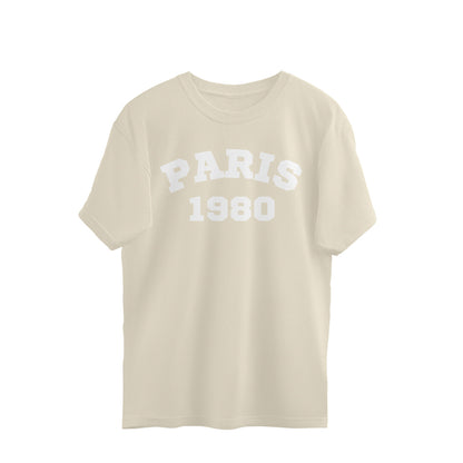 Off-white oversized t-shirt with PARIS 1980 text, streetwear fashion style